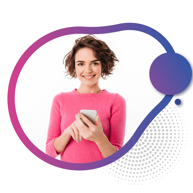 A person in a pink sweater holding a smartphone, symbolizing the convenience and instant accessibility of on-demand eSIM services in Australia